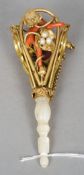 A 19th century seed pearl, coral and coloured paste set gilt metal and mother-of-pearl posy holder