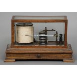 An early 20th century oak cased barograph
Of typical form the glass cased instrument above a plinth
