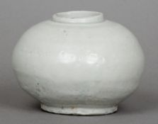 An 18th century Korean Choson Dynasty porcelain jar
Of squat baluster form.  8 cm high.  CONDITION