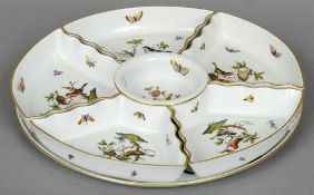 A Herend porcelain hors d'oeuvre dish
The segmented vessel typically decorated with birds and