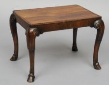 A Queen Anne style walnut footstool (converted to a side table)
With a lift out top, standing on