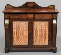 A Regency brass inlaid rosewood side cabinet
The arched shaped back above the line inlaid