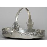 ARCHIBALD KNOX (1864-1933) British, for Liberty & Co.
An "English pewter" oval basket
With pieced