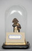 A 19th century model of Louis Napoleon
The head carved from a nut with glass inset eyes, the main