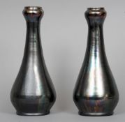 A pair of English Art pottery vases
Each of slender baluster form with onion neck and thick lustrous
