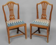 A set of six 18th century elm dining chairs 
Each pierced shield back above the kilim upholstered