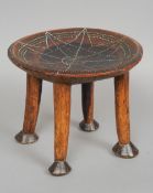 An African tribal stool
The dished top with bead work decoration.  32 cm diameter. CONDITION