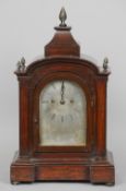 A 19th century mahogany cased eight day mantel clock
The arched silvered dial signed Sargent, 21