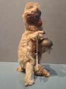 A 19th century French automaton mechanical model of a dancing monkey
With articulated head and limbs