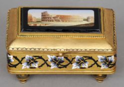 A 19th century micro-mosaic set and enamel decorated gilt metal box
The hinged cover with inset