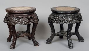 Two small late 19th/early 20th century Chinese marble topped carved hardwood urn stands
Each with