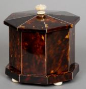 A 19th century ivory mounted tortoiseshell and mahogany tea caddy
Of octagonal form with flattened