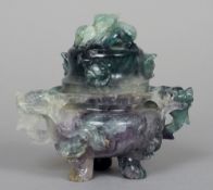 A Chinese carved fluorite censor and cover
Of typical domed form, carved with mythical beasts,