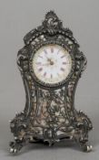 A 19th century Continental unmarked silver and mother-of-pearl desk clock
Of pierced scrolling form,