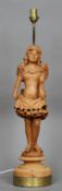 A 19th century carved pine figural lamp base
Modelled as a young girl wearing a bow tied dress,