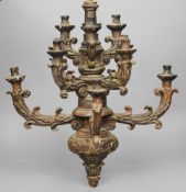 An early 18th century Italian carved silvered giltwood chandelier
The turned centre column with an