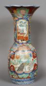 A large late 19th century Japanese floor vase
Decorated in the Imari palette with vignettes of