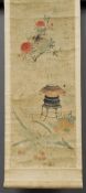 A 19th century Chinese scroll painting
Depicting an urn on stand amongst blossoming and fruiting