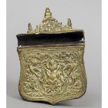 An antique Balkans brass cartridge case
The shield shaped body with embossed decoration, the