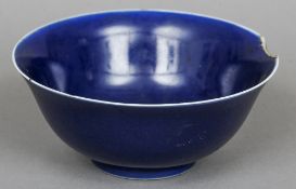 A Chinese porcelain blue glazed bowl
Of typical form with blue painted six character Qianlong seal