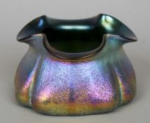 An iridescent Art glass vase (possibly Loetz)
Of squat crimped form, decorated with green, purple