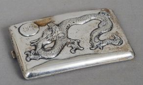 A Chinese silver plated cigarette case
The front decorated in relief with a dragon and with an