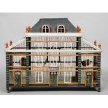 A 19th century French architectural bird cage
Formed as a chateau with painted decoration.  105 cm