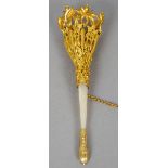 A gilt metal and mother-of-pearl posy holder
The basket pierced and foliate cast.  14.5 cm long.