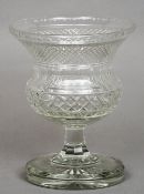 A 19th century cut glass vase With flared rim, standing on a circular foot. 25.5 cms high. CONDITION