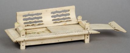 A Napoleonic period bone prisoner-of-war dominoes set
Housed in a pierced and carved box.  21.5 cm