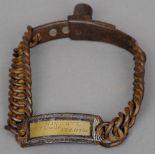 An early 19th century cast iron dog collar
The identity tag engraved Wickett Chemist, Stratton.
