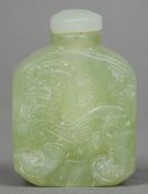A Chinese carved jade snuff bottle and stopper
Worked with the figure of a dragon.  6 cms high.