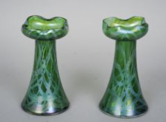 A pair of green iridescent Art glass vases
Each of conical form with a crimped flared neck.  Each