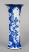 A 19th century Chinse blue and white sleeve vase
Of typical flared form, decorated with figures