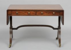 A 19th century mahogany sofa table
The moulded twin flap rectangular top above two frieze with two