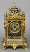 A 19th century champleve enamel decorated ormolu mantel clock
46 cm high.