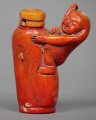 A Chinese simulated coral snuff bottle, possibly mineral or glass
Modelled with a figure holding a