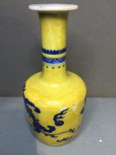 An 18th century Chinese porcelain vase
Of mallet shape, decorated in underglaze blue with dragons