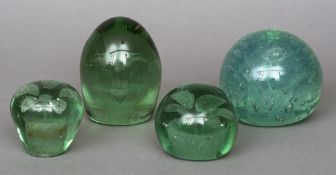 Four 19th century glass dump weights
Of varying shapes and sizes,