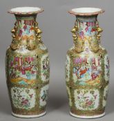 A pair of large 19th century Cantonese famille rose vases
Each typically decorated with vignettes of