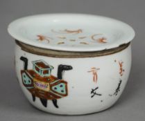 A small 19th century Chinese porcelain bowl and cover
The pierced lid above the squat body decorated