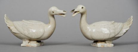 A pair of Chinese pottery celadon glazed ducks
Each naturalistically modelled.  12.5 cm high.  (2)