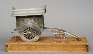 A fine quality Chinese unmarked silver model of a rickshaw 
With engraved and cast decoration, the