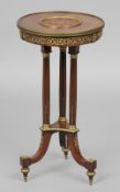 A 19th century Continental brass mounted inlaid tripod table
The inlaid circular top with scroll