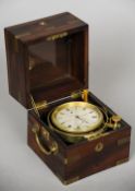 A late 19th century brass bound mahogany cased marine chronometer