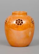 A Ruskin pottery reticulated ginger jar
With orange lustre glaze, impressed mark Ruskin, England and