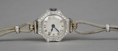 A platinum and diamond set cocktail watch
The octagonal dial with Arabic numerals,