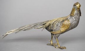 An unmarked Continental white and gilt metal model of a Asiatic pheasant 
Naturalistically modelled.