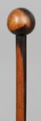 A finely carved African wood staff, probably Zulu 
Together with a Zulu knobkerrie, of typical form.