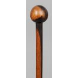 A finely carved African wood staff, probably Zulu 
Together with a Zulu knobkerrie, of typical form.